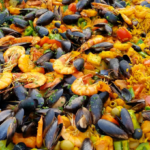 Paella Valenciana: Brimming with Saffron‑infused Rice, Seafood, and Chorizo