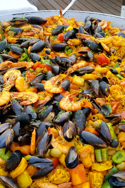 Paella Valenciana: Brimming with Saffron‑infused Rice, Seafood, and Chorizo